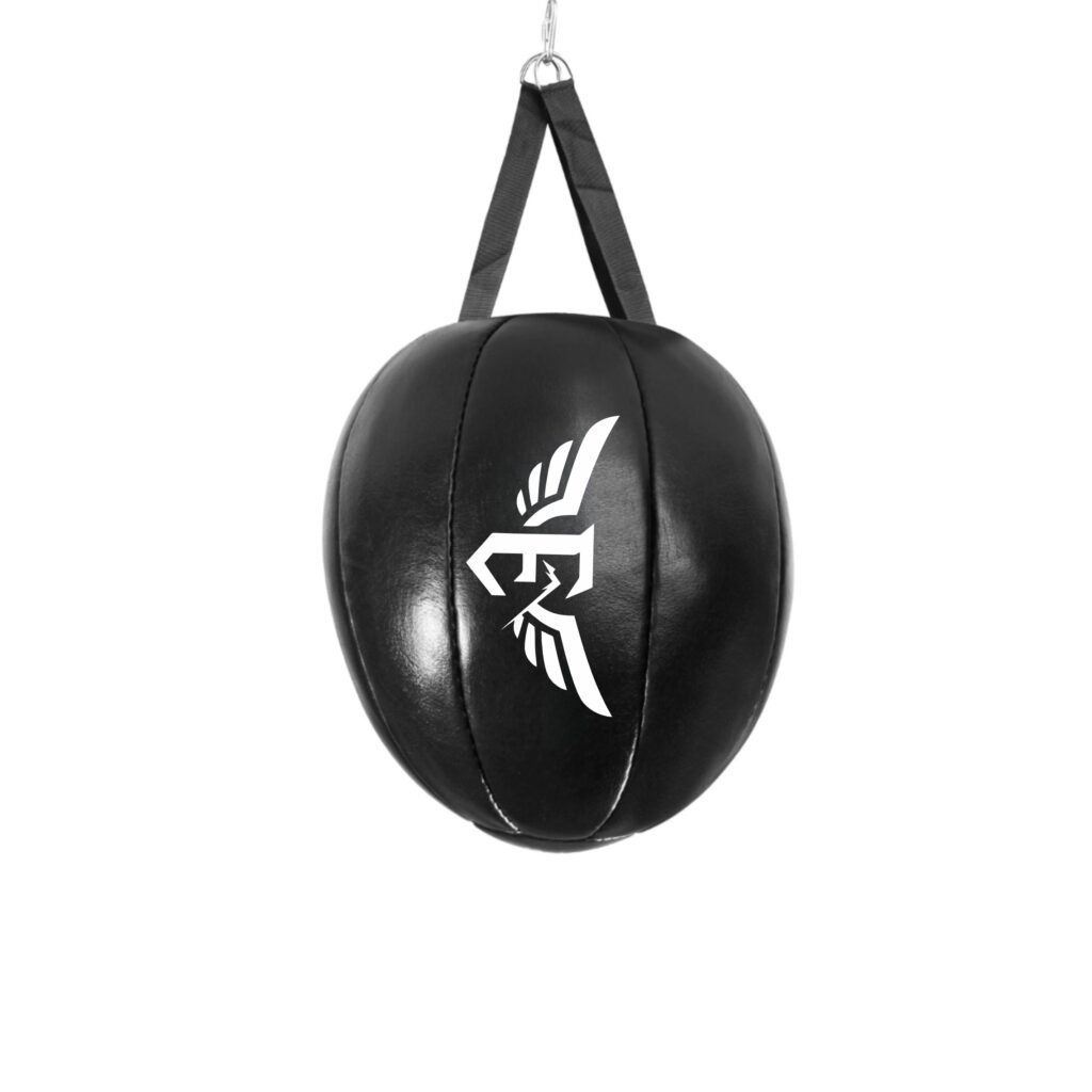 Heavy Boxing Punching Bag in Home Gym Setting High-resolution photo of a heavy boxing punching bag suspended from a secure mounting, showing the durable construction, contrast stitching and sufficient length for full striking. The setup is placed against a clean indoor backdrop illustrating a stylish home gym environment.